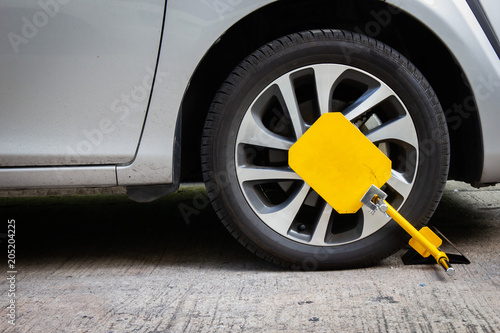 Wheel lock for anti-theft with the car on the road or concrete floor.