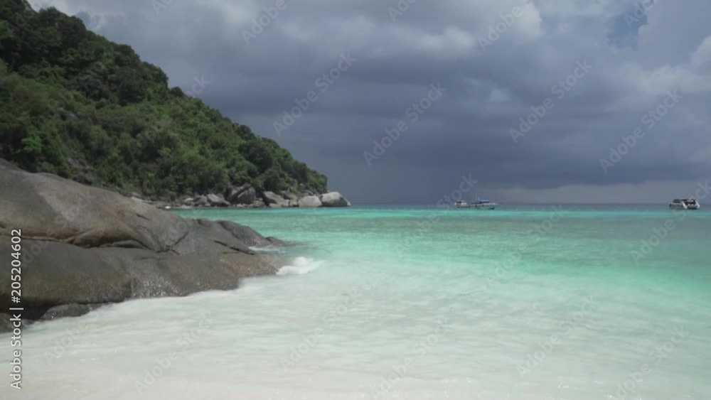 White sandy tropical beach over beautiful sea and cloudy sky background White sandy tropical beach over beautiful sea and cloudy sky background