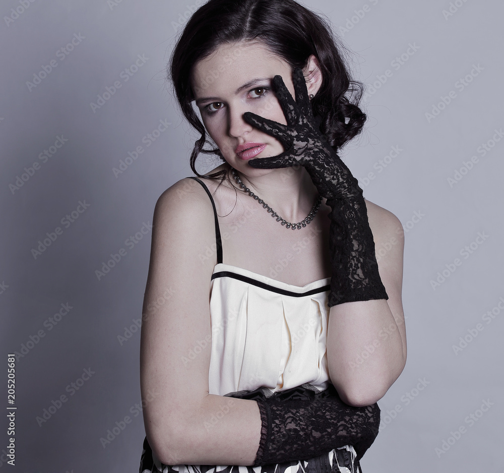portrait of stylish young woman.isolated on gray background portrait of stylish young woman.isolated on gray background