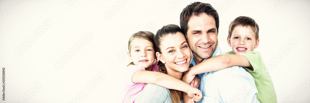 Portrait of smiling parents giving piggy-back to children Portrait of smiling parents giving piggy-back to children