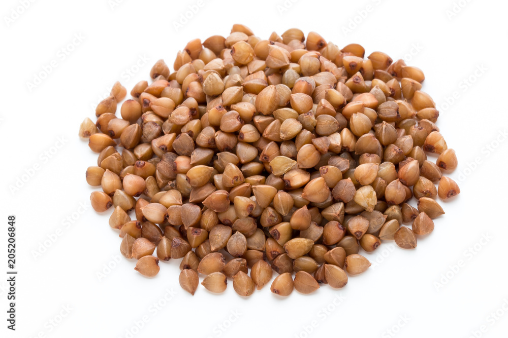 Buckwheat grains isolated on the white background. Buckwheat grains isolated on the white background.