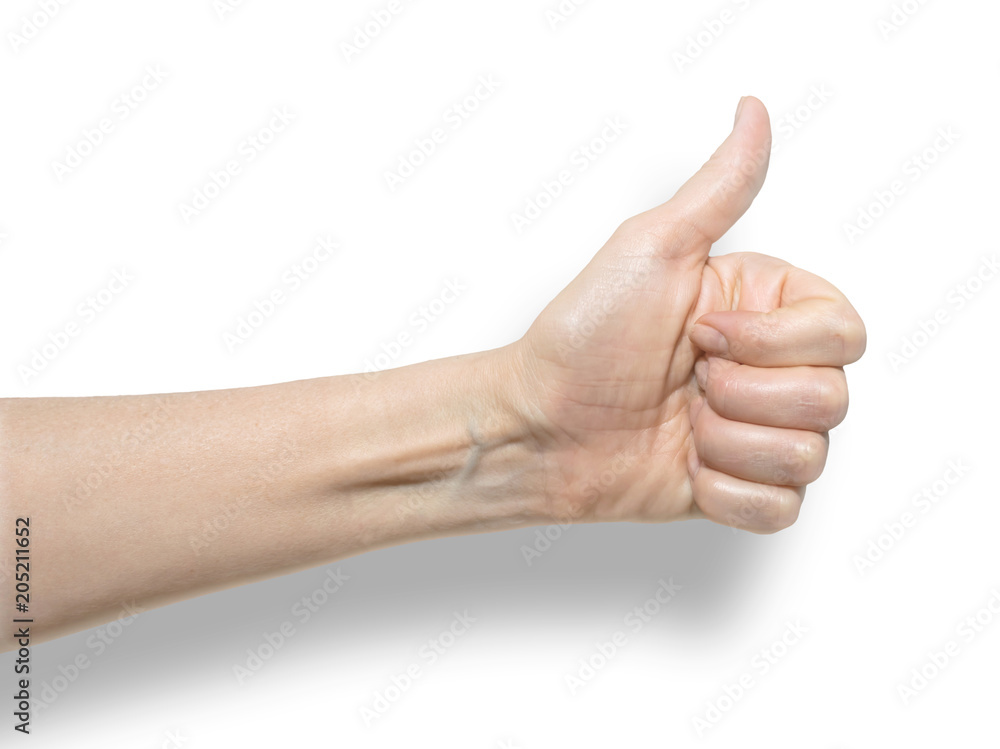 Closeup of female hand showing thumb up sign against white background with shadow. Isolared communication gesture object