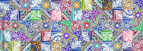 Composition of typical portuguese decorations with colored ceramic tiles called -azulejos- It's a seamless texture that can be repeated modularly to create a uniform and continuously background photo