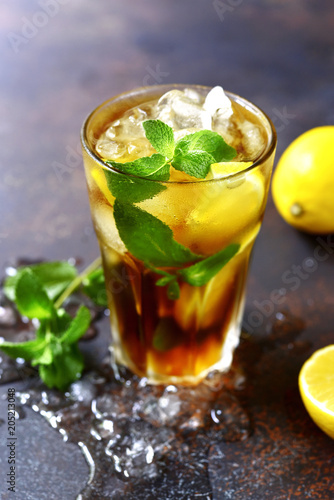 Coold summer cocktail long island or iced tea with lemon.