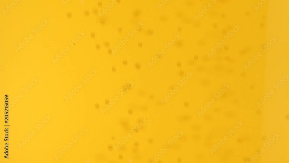 Close up of beer with bubbles. No sound. This file is cleaned and retouched. Close up of beer with bubbles. No sound. This file is cleaned and retouched.
