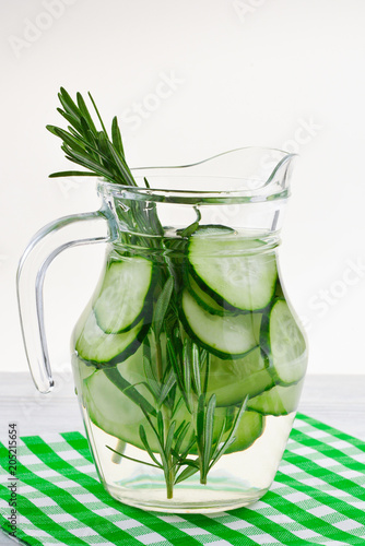 Cucumber and Rosemary Infused Water on wooden table