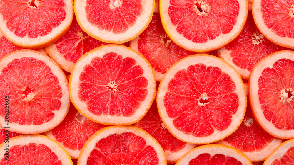 Grapefruit red juicy slices background. top view Grapefruit red juicy slices background. top view