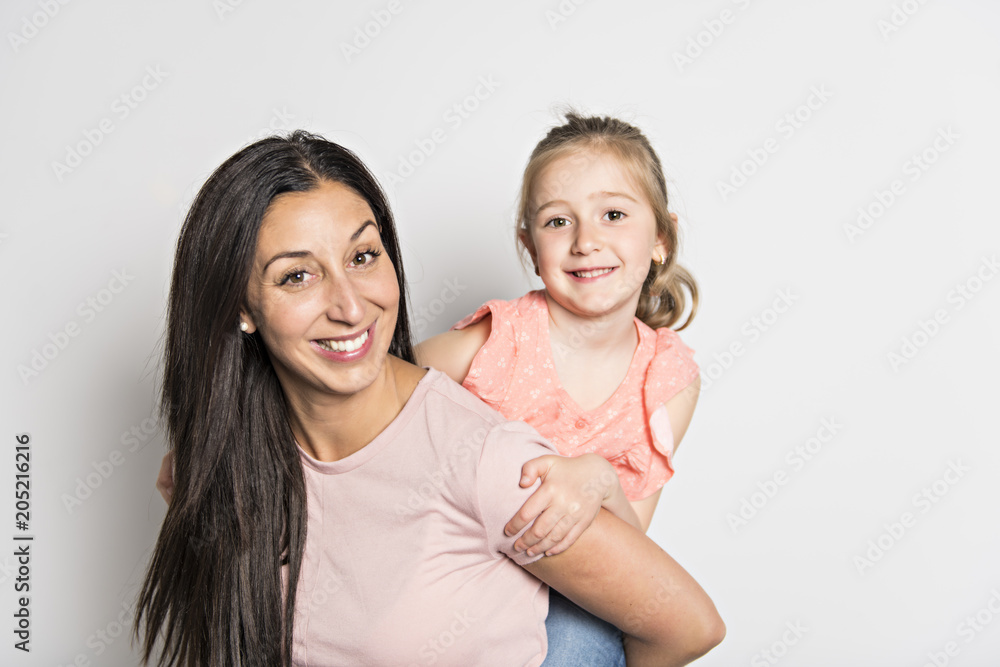 pretty mother standing with her cute daughter pretty mother standing with her cute daughter