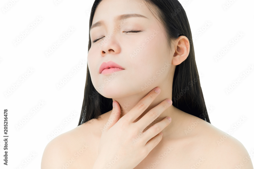 women hands are touching the neck because there is a red rash around the neck, a gray background gives soft light. women hands are touching the neck because there is a red rash around the neck, a gray background gives soft light.