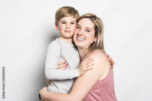 Mother and son on studio white background