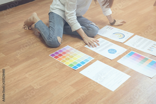 Businesswoman in office in casual shirt. Check document color template for graphic designer and choose sample to match the publication.