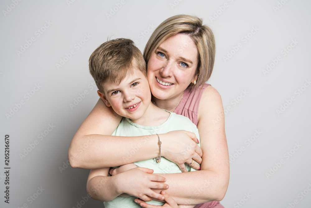 Mother and son on studio white background Mother and son on studio white background