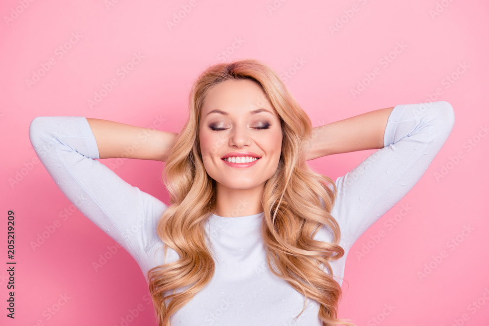 Portrait of positive cheerful girl with modern hairdo natural makeup beaming smile holding hands behind the head keeping eyes closed dreaming about journey, trip, traveling Portrait of positive cheerful girl with modern hairdo natural makeup beaming smile holding hands behind the head keeping eyes closed dreaming about journey, trip, traveling