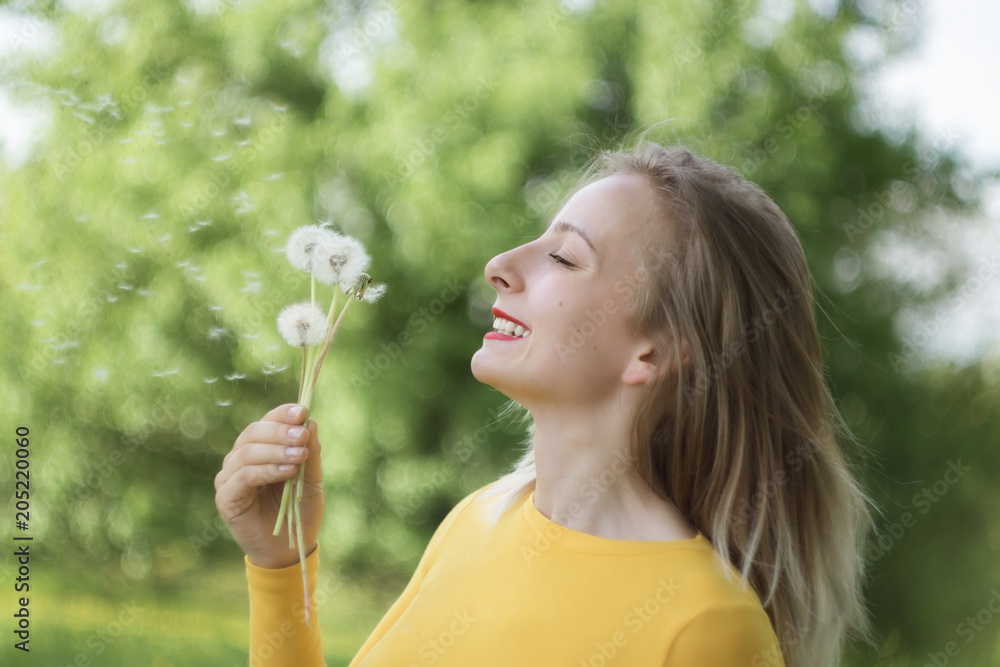 Portrait of a young woman with a dandelion Portrait of a young woman with a dandelion