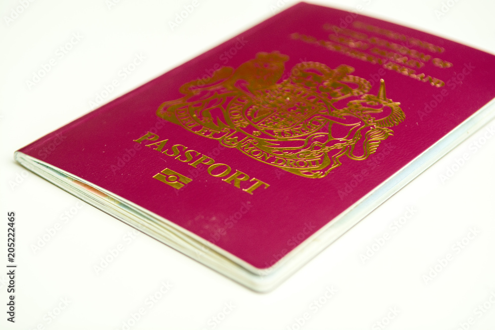 UK Passport isolated on white background, official British passport document UK Passport isolated on white background, official British passport document
