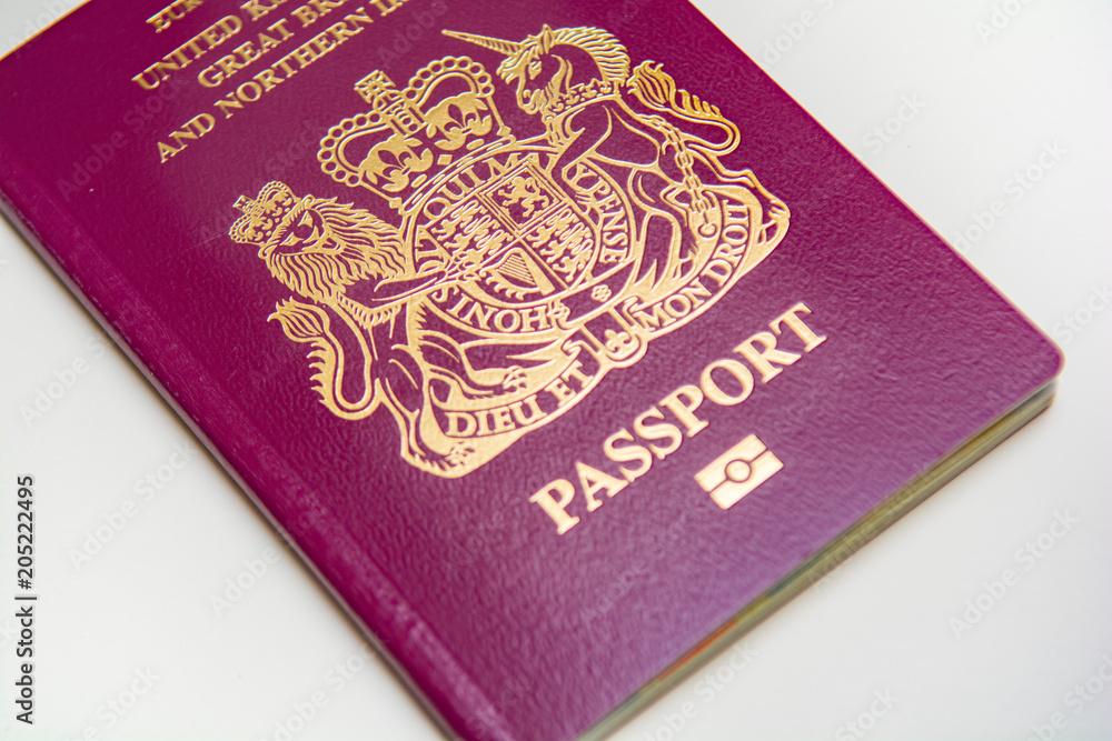 UK Passport isolated on white background, official British passport document UK Passport isolated on white background, official British passport document