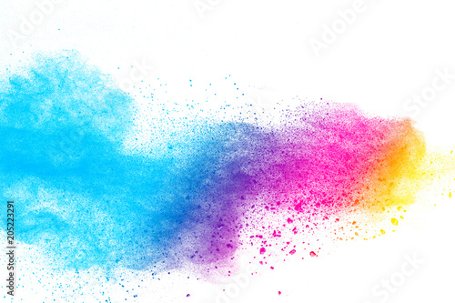 Multi color powder explosion on white background. Launched colorful dust particles splashing. © Pattadis