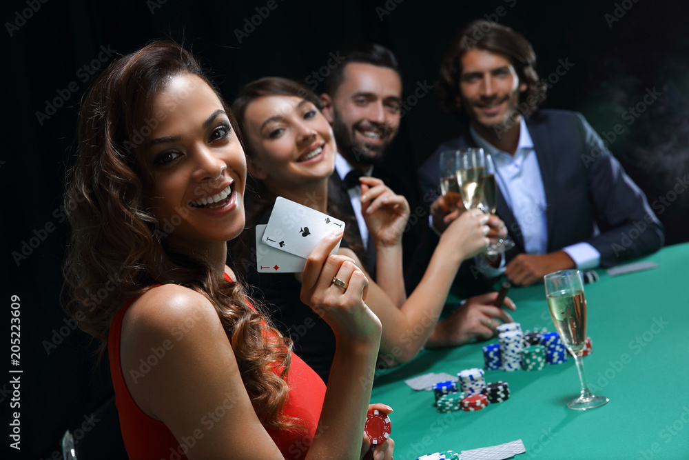 © ASDF - adult group celebrating friend winning blackjack