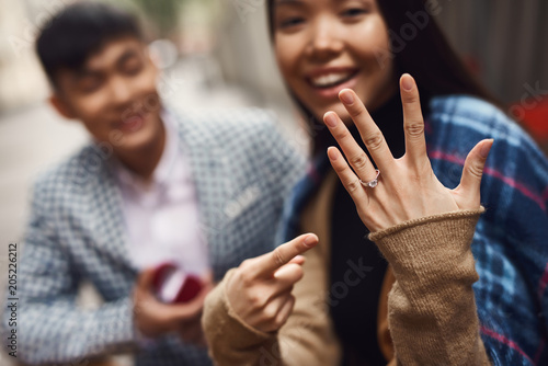 Close up. Man makes proposal of marriage to girl.