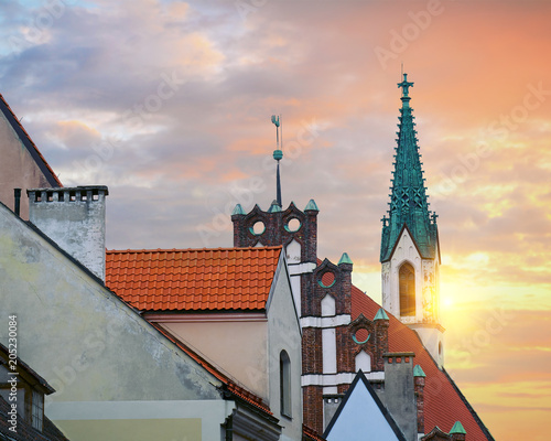 Red roofs of old houses in Skarnu iela street with St Johns church in the background Riga, Latvia