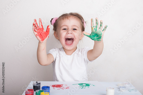 the child leaves his handprints on paper