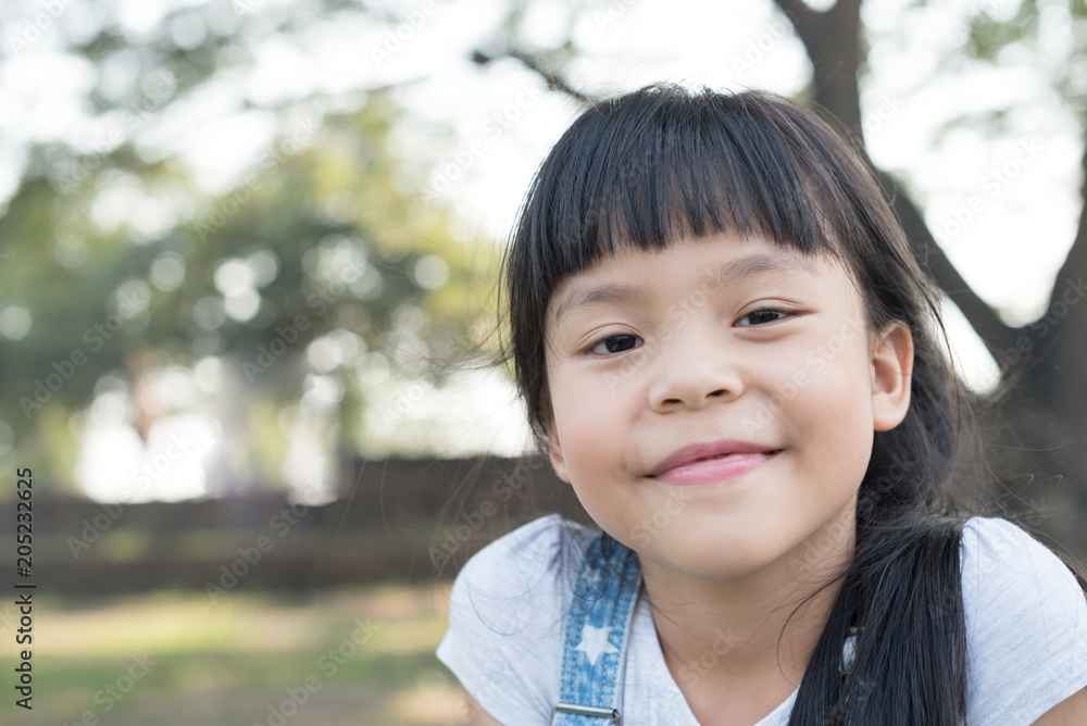 Happy little girl having fun at the park Happy little girl having fun at the park