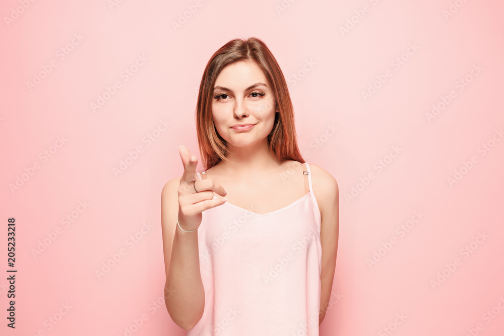 The happy woman point you and want you, half length closeup portrait on pink background. The happy woman point you and want you, half length closeup portrait on pink background.