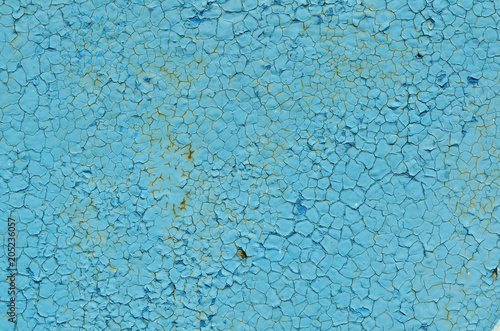 Cracking and peeling paint on a wall