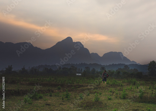 Van Vieng, Laos mountains and a backpacker © Mikko