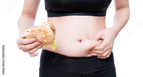 She pulls the hand skin showing fat in the abdomen and flanks with big hamburger in hand