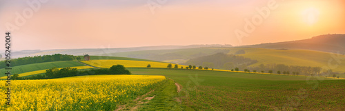 Old windmill at sunset. Spring landscape. Moravia fields panorama photo