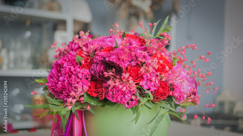 Beautiful wedding bouquet in florist studio. Floristry and handmade concept © zyabich