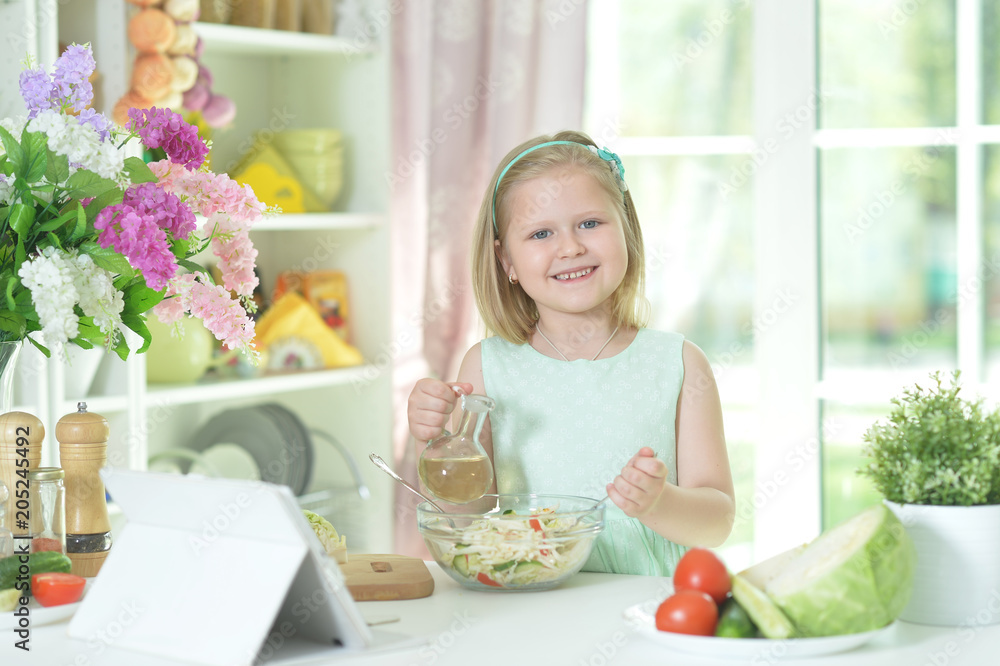 Cute little girl preparing salad Cute little girl preparing salad