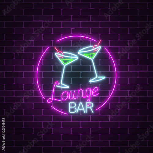 Neon cocktails lounge bar sign on dark brick wall background. Glowing gas advertising with glasses of alcohol shake.