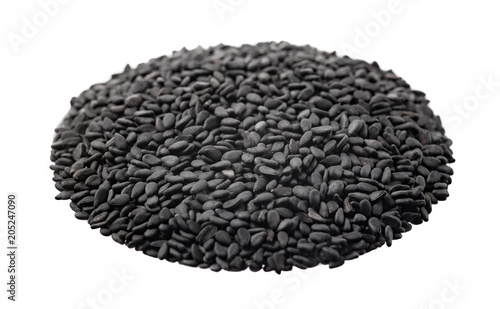 Black sesame seeds on white background