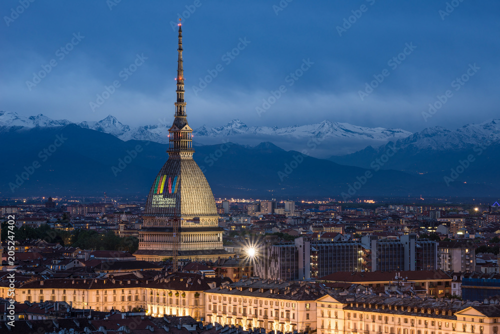 Turin skyline at dusk, panorama cityscape with the Mole Antonelliana showing 