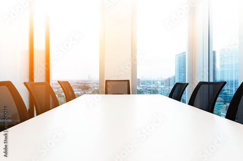 Modern meeting room with for present, large windows outside building, city, tower view, soft focus