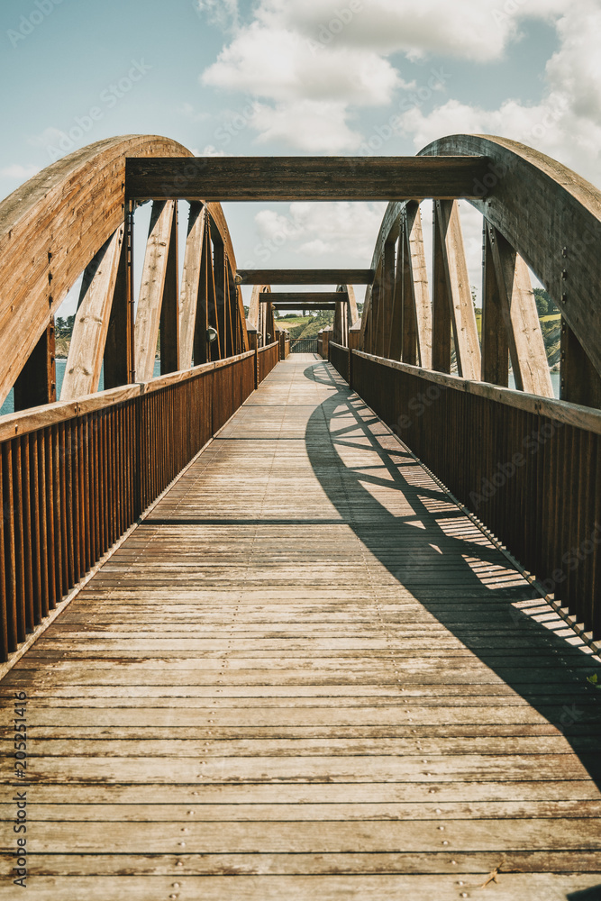 perspective of a wooden bridge in ribadeo, spain perspective of a wooden bridge in ribadeo, spain