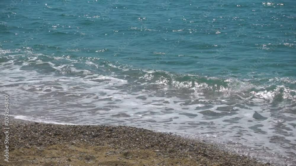 Sea surf of Aegean Sea. Mykonos Island, Greece Sea surf of Aegean Sea. Mykonos Island, Greece