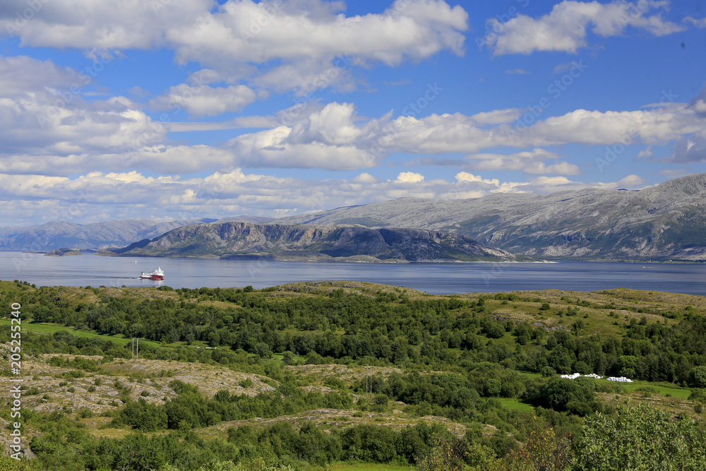 Cycling on the island of Ylvingen a great summer day, Northern Norway