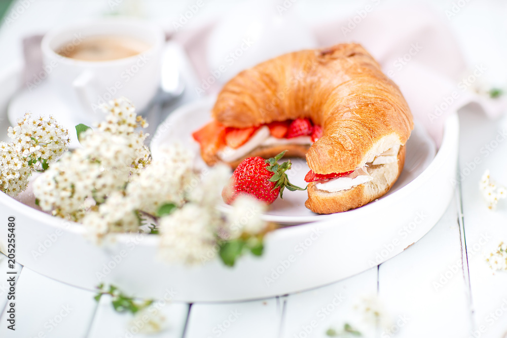 Morning background . Breakfast with coffee and croissants. light key Morning background . Breakfast with coffee and croissants. light key