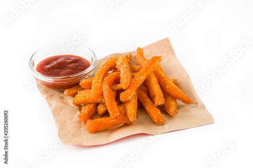 Sweet potato fries and ketchup sauce isolated on white background

