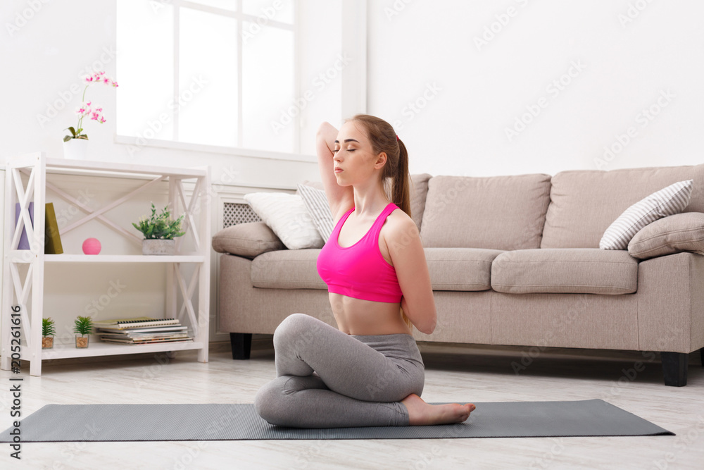 Woman training yoga in cow head pose. Woman training yoga in cow head pose.
