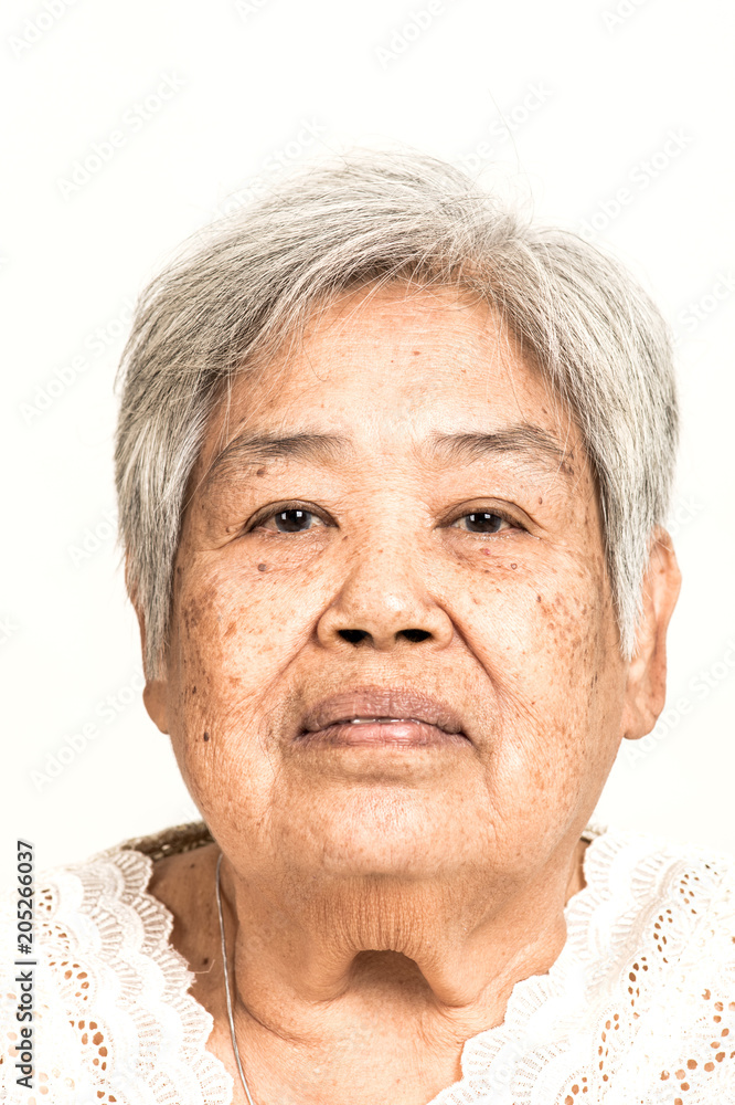 Serious looking senior woman portrait. Dramatic look. Old chinese woman. Serious looking senior woman portrait. Dramatic look. Old chinese woman.