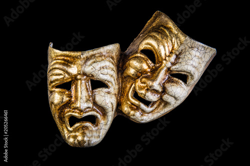 theatrical mask smile and sadness on a black background