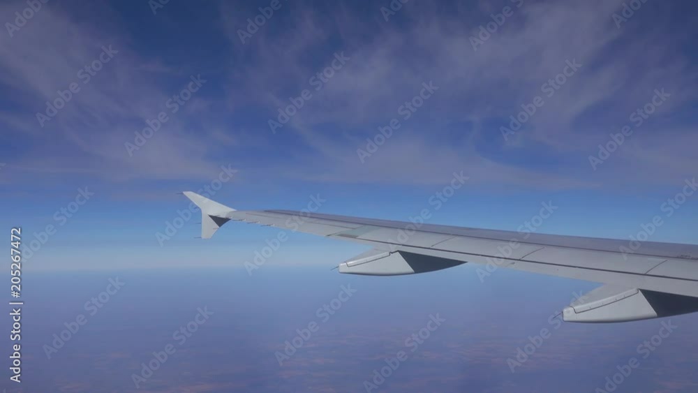 looking on wing and sky from airplane, 4k looking on wing and sky from airplane, 4k