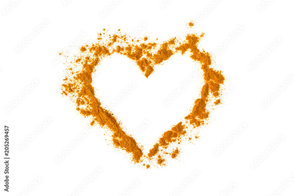 Turmeric powder in the shape of a heart. Isolated on white. Empty space for text or description.