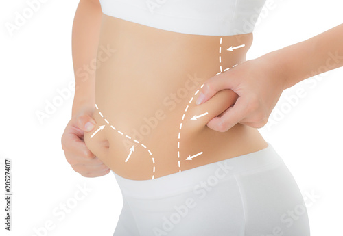 Close up woman grabbing skin on her hip and belly with the drawing arrows, Lose weight and liposuction cellulite removal concept, Isolated on white background. photo