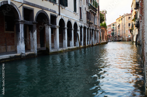 Venetian portico and canal, Venice, Italy