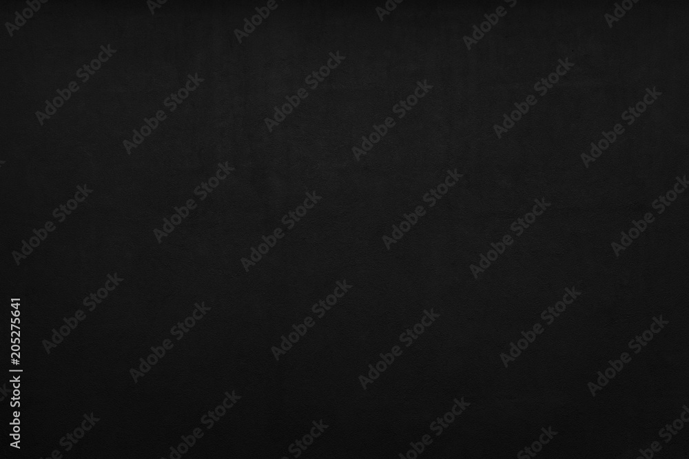 Cement or plaster wall. Black background.